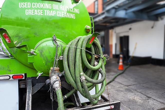 an industrial grease trap being pumped out in Aurora